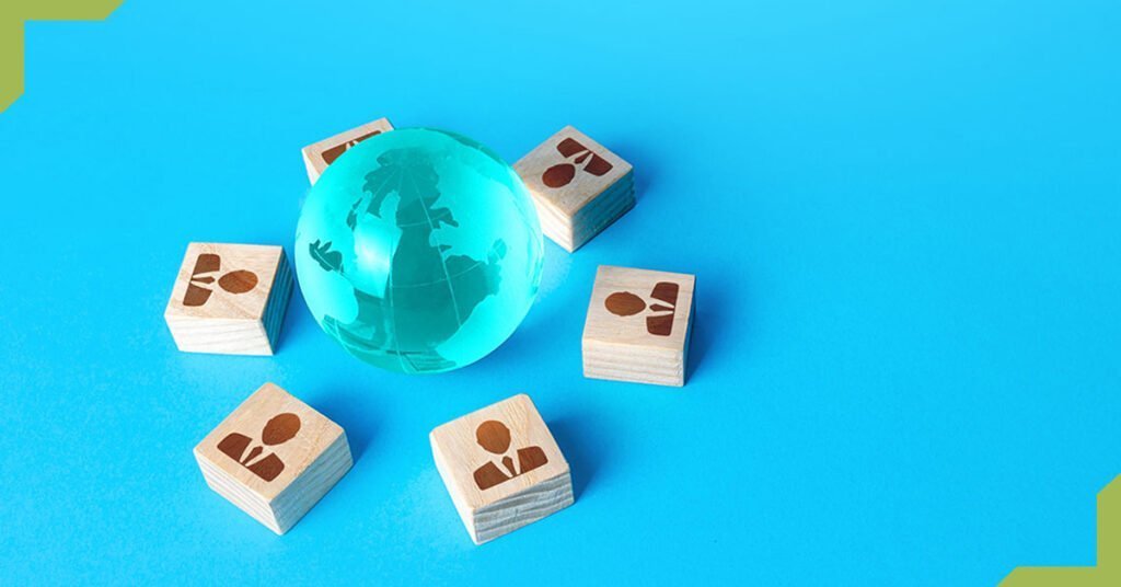 Globe and people blocks illustrating how to scale software development by outsourcing